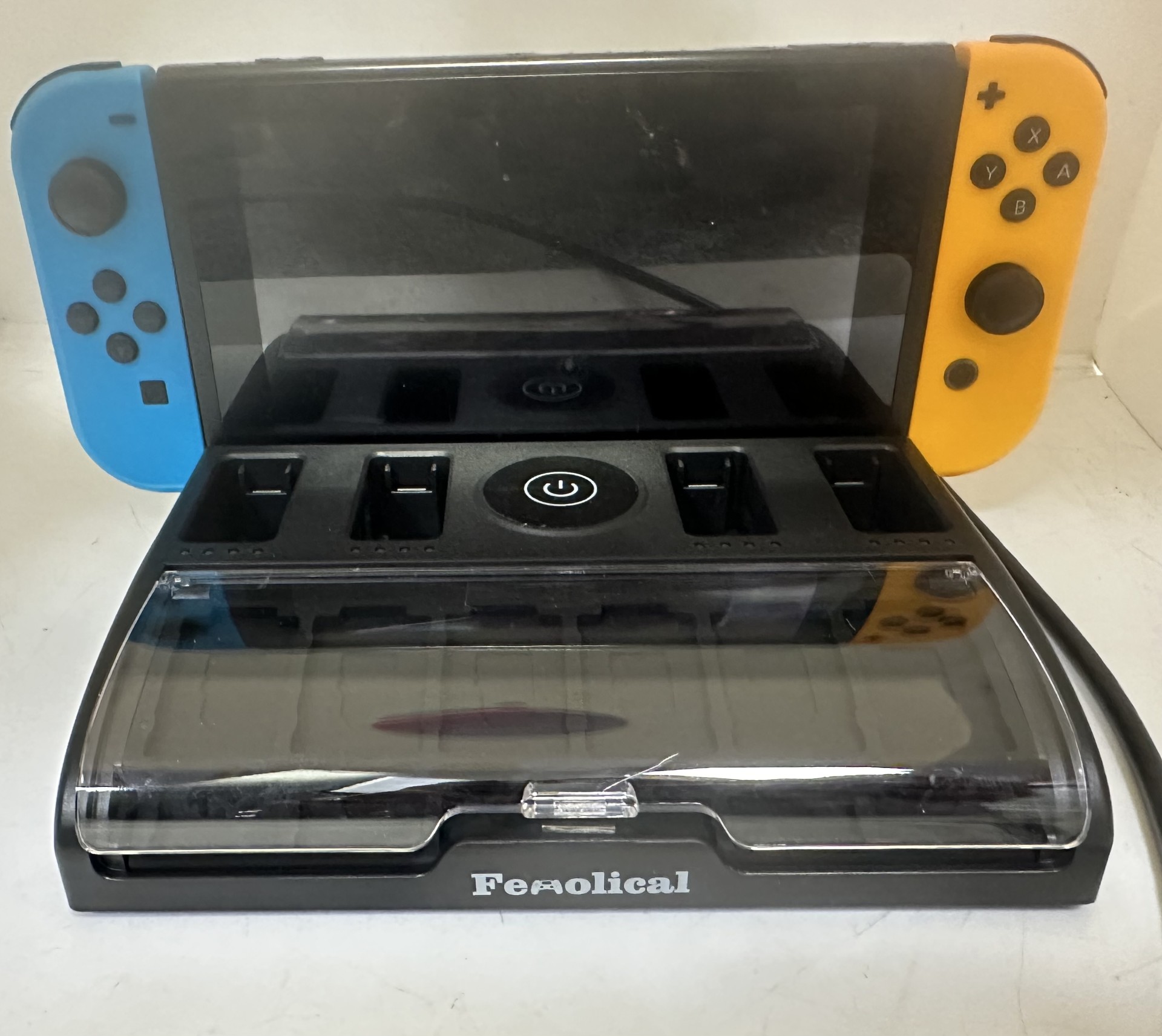 Nintendo Switch Console-Blue/Orange Joycons With Femolical Charging Dock 