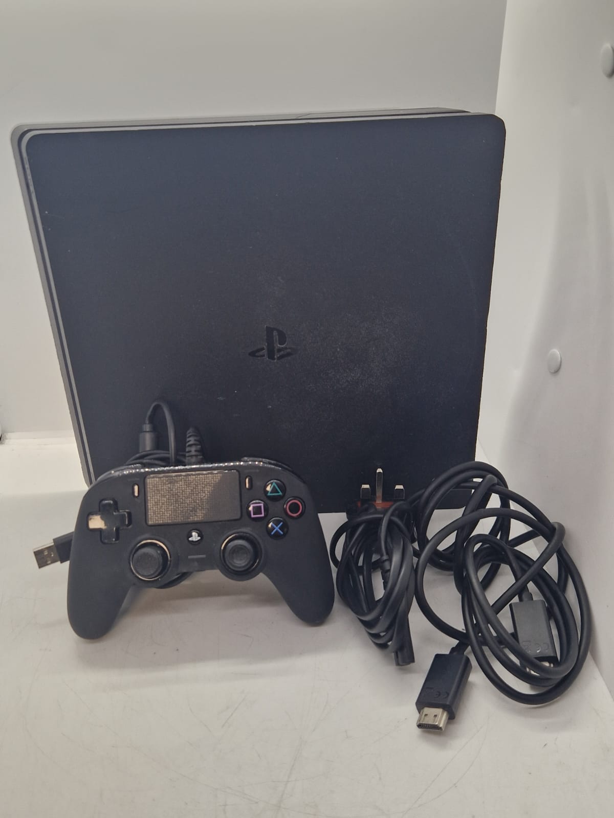 Sony PlayStation 4 Slim 500GB Home Console - Jet Black With a Wired Controller